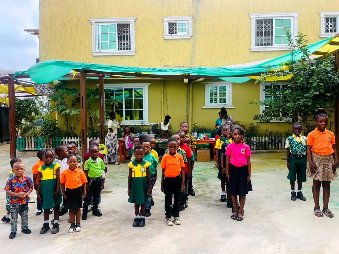 ASMA pupils at an outdoor assembly in the school grounds