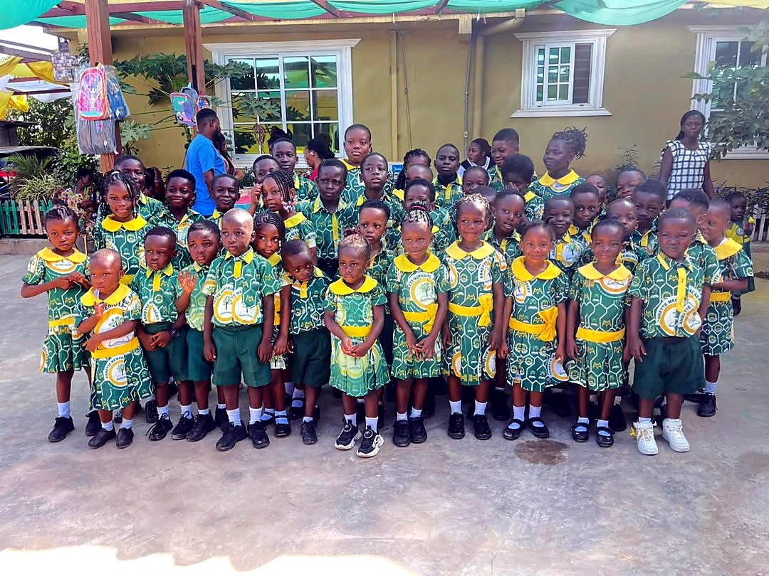 ASMA pupils gathered in their green and gold school uniforms