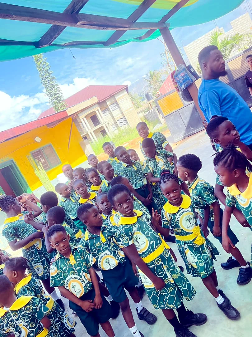 ASMA pupils together beneath the courtyard canopy