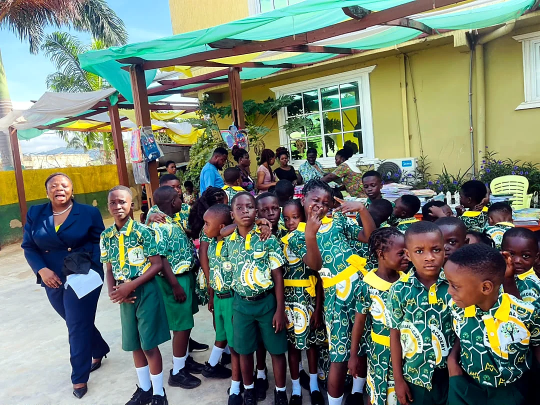 ASMA pupils and a teacher during a lively school gathering