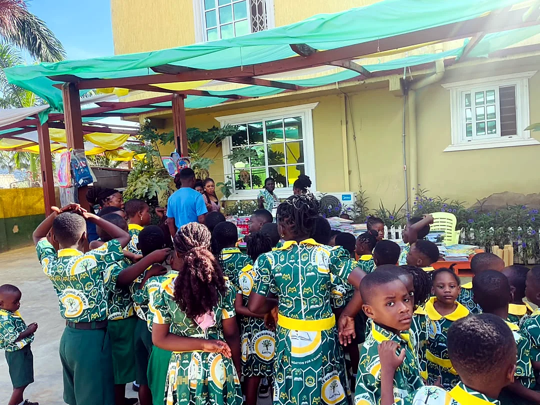 ASMA pupils gathered around a school activity table
